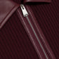 Close-up of the Simkhai Ismelle Midi Dress in burgundy, showcasing its ribbed knit fabric, silver partially unzipped zipper, and distinctive leather collar.