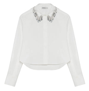 Simkhai Renata Embellished Collar Cropped Shirt in white, featuring a button-down design and a collar adorned with silver beaded fringe.