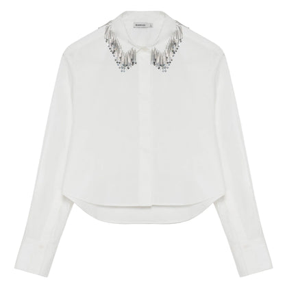 Simkhai Renata Embellished Collar Cropped Shirt in white, featuring a button-down design and a collar adorned with silver beaded fringe.
