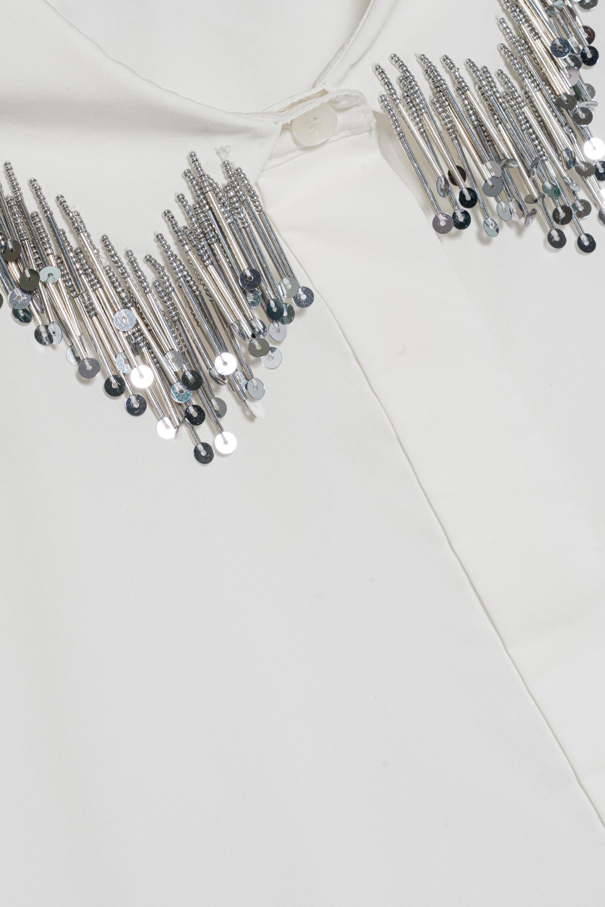 Simkhai Renata Embellished Collar Cropped Shirt in white cotton poplin with a collar adorned by silver metallic fringe and sequins.