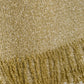 Close-up of the metallic gold bouclé Zeni Midi Skirt with a fringed hem accented by small white pearls.