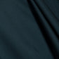 Deep teal satin fabric of the Simkhai Ora Satin Gown featuring soft, asymmetrical folds.