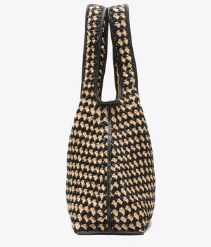 The Crochet Raffia Market Tote by 3.1 Phillip Lim features a black and beige geometric design, two handles, and a structured rectangular shape—making it the perfect stylish shopping tote for carrying your everyday essentials.