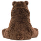 The large brown Bizzlestomp Bear by Jellycat sits with its back to the viewer, highlighting its fluffy fur and signature round ears.