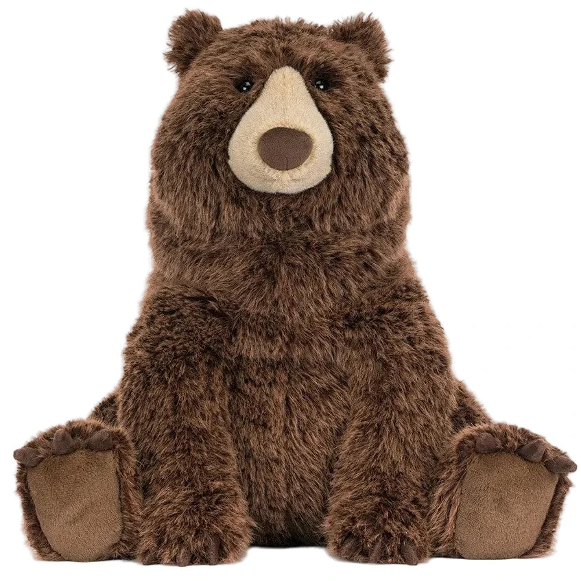A plush brown Bizzlestomp Bear by Jellycat sits upright with soft fur, round ears, and a beige snout and feet against a white background.