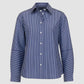 The Aura Top by Callas Milano is a long-sleeve, button-up shirt made from Italian stripe poplin with blue and white vertical stripes and contrasting horizontal stripes on the lower sleeves.