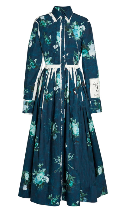 The Erdem Long Sleeve Abstract Rose Shirt Dress features a button-down, collared design in cotton faille with dark teal floral print, white streak accents, and a monochrome patch on one sleeve.