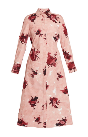 The Erdem Long Sleeve Abstract Rose Shirt Dress is a pink cotton poplin shirt dress with a collar, button-down front, and red abstract rose bouquets print, shown against a plain background.