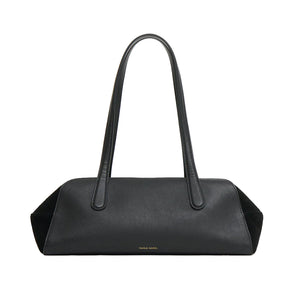 The Mansur Gavriel Helios Bag is rectangular, made of black leather, features two long shoulder straps, and has minimal gold branding at the bottom center.