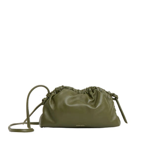 The Mini Cloud Clutch by Mansur Gavriel in olive green Italian lambskin features a ruched top and slim shoulder strap, displayed on a plain white background.