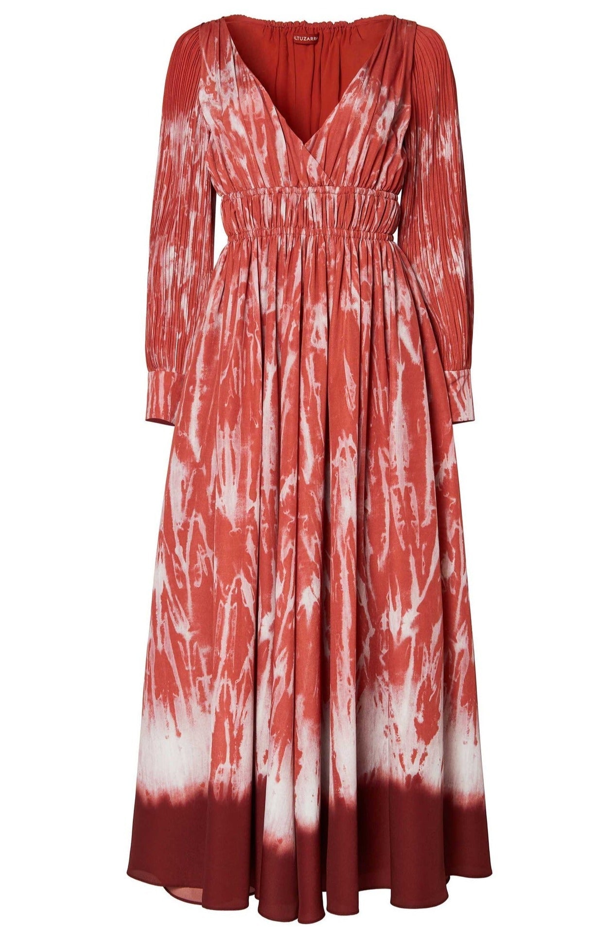 The Kathleen Dress by Altuzarra is a long-sleeve dress with a red and white tie-dye shibori pattern, featuring a deep V-neck, pleated shoulder details, and an elasticated waist for comfort.