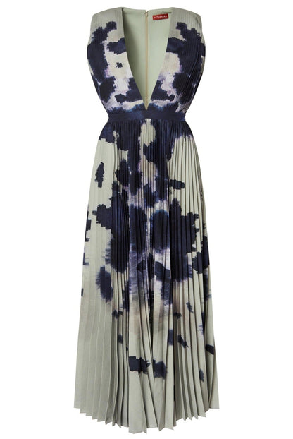 An Altuzarra Pamela Dress with a deep V-neck, featuring a grey and black abstract print and pleated skirt.