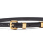 An Italian-made Altuzarra Skinny Belt in black leather, featuring a gold buckle and gold loop.