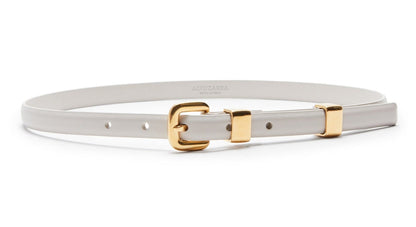 The Altuzarra Skinny Belt, made in Italy from white calf leather, showcases a gold buckle with two elegant gold loops, providing a stylish and sophisticated touch.