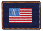 The Smathers & Branson American Flag Card Wallet features a stitched American flag design on navy blue, framed by a brown hand-stitched leather border.