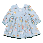 A children's Amma Dress by Pink Chicken, featuring long sleeves and a festive pattern of musicians, floral motifs, and animals inspired by the 12 Days of Christmas, available in blue.