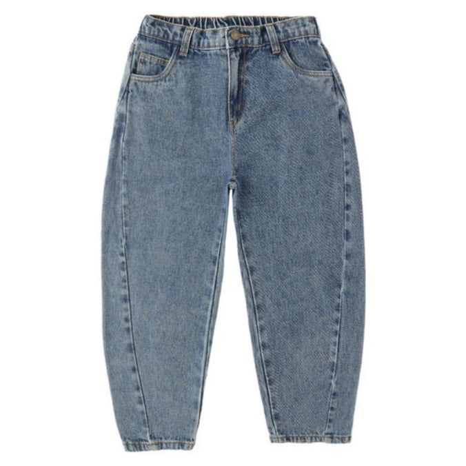 The Girls' Barrel Pant by Rylee & Cru is a high-waisted, light blue pant featuring a relaxed silhouette, tapered legs, and front and back pockets, shown laid flat on a white background.
