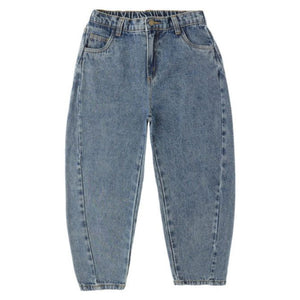 The Girls' Barrel Pant by Rylee & Cru is a high-waisted, light blue pant featuring a relaxed silhouette, tapered legs, and front and back pockets, shown laid flat on a white background.