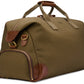 The Bennett Winch Canvas Weekender is a spacious olive green bag made from waterproof canvas and accented with full-grain leather, featuring sturdy handles, gold zippers, and an upright design.