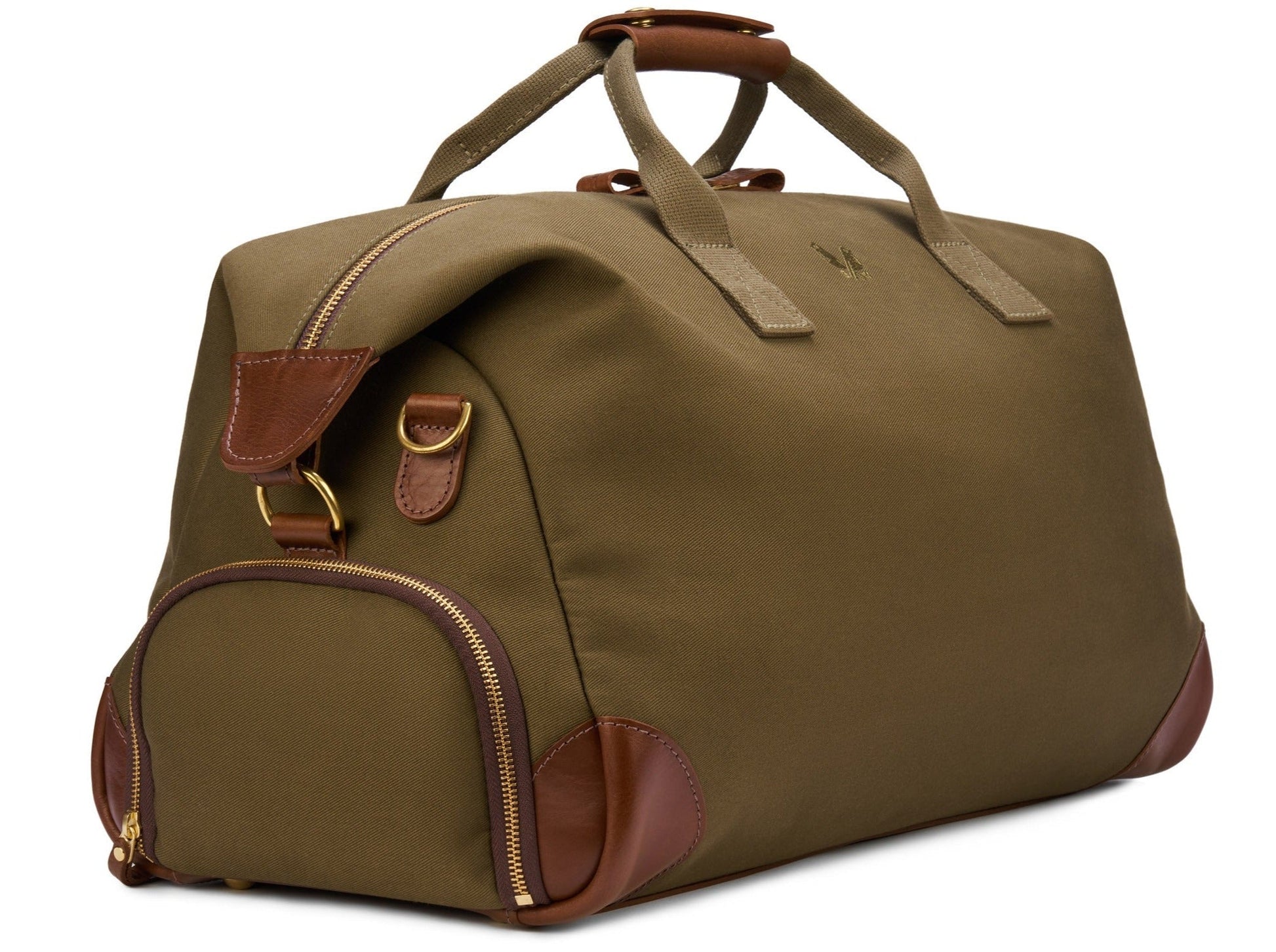 The Bennett Winch Canvas Weekender is a spacious olive green bag made from waterproof canvas and accented with full-grain leather, featuring sturdy handles, gold zippers, and an upright design.