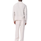 A person faces away, wearing the Rag & Bone Angus Linen Shirt Jacket with matching pants and light shoes, set against a white background.