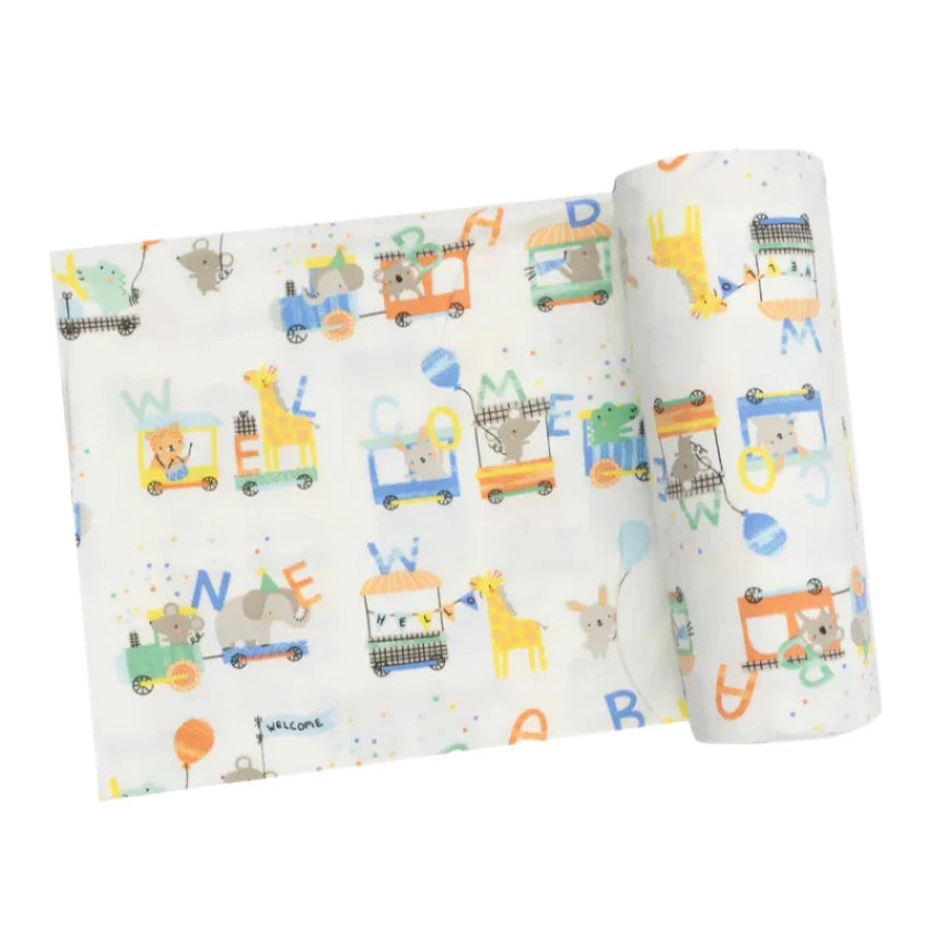 The Angel Dear Animal Train Swaddle Blanket by Angel Dear is a versatile, soft baby blanket that can be rolled or unrolled, showcasing colorful illustrations of animals and toy cars along with the word "Welcome.