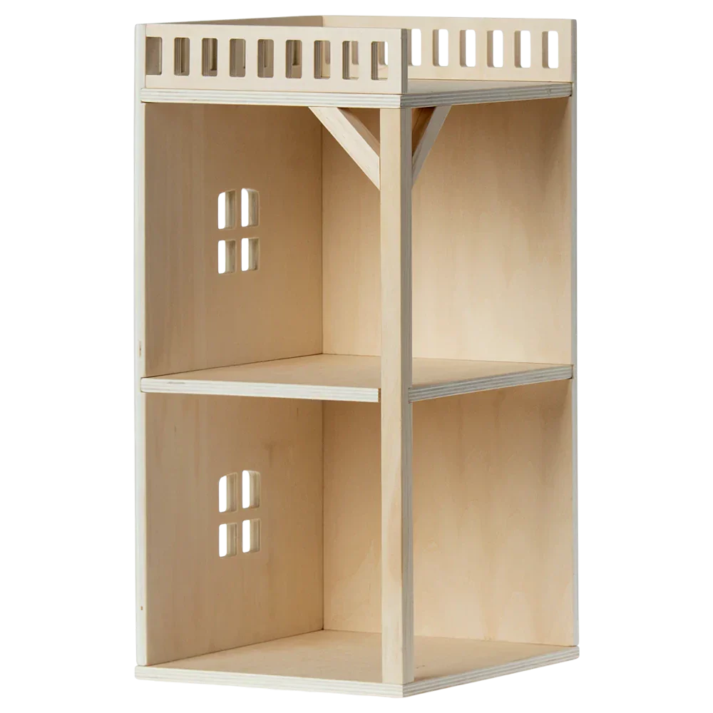 A wooden two-shelf display unit featuring lattice-style top edges and small square cutouts on the back panel, specifically crafted for home or office storage. It's perfect to complement Maileg's Mouse Hole Farmhouse - Annex collection or add a charming touch reminiscent of the Mouse Hole Farmhouse decor from Maileg.