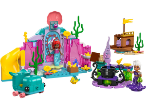 Explore the colorful underwater world with LEGO® Disney™ Ariel's Crystal Cavern by Legos - Toyhouse. This captivating set includes a LEGO Disney Princess mermaid, a detailed castle, charming sea creatures, and an enigmatic purple tentacled figure watching over a bubbling cauldron.