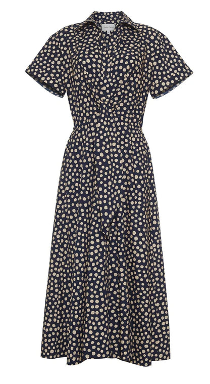 Cara Cara Asbury Dress: A chic short-sleeved shirt dress with a black background and beige polka dot pattern, featuring a collar, button-down front, and a stylish self-tie waist.