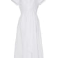 Cara Cara's Asbury Dress is a white, short-sleeve cotton poplin shirt dress with a collar and self-tie waist detail, complemented by a flared skirt.