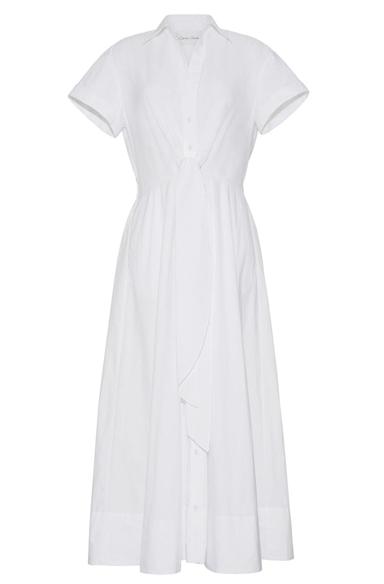 Cara Cara's Asbury Dress is a white, short-sleeve cotton poplin shirt dress with a collar and self-tie waist detail, complemented by a flared skirt.