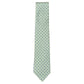 The Atomic Diamond Tie by Robert Jensen is a light green silk tie with a repeating pattern of small blue and white geometric shapes.