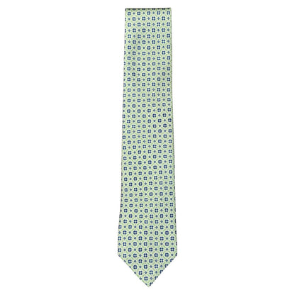 The Atomic Diamond Tie by Robert Jensen is a light green silk tie with a repeating pattern of small blue and white geometric shapes.