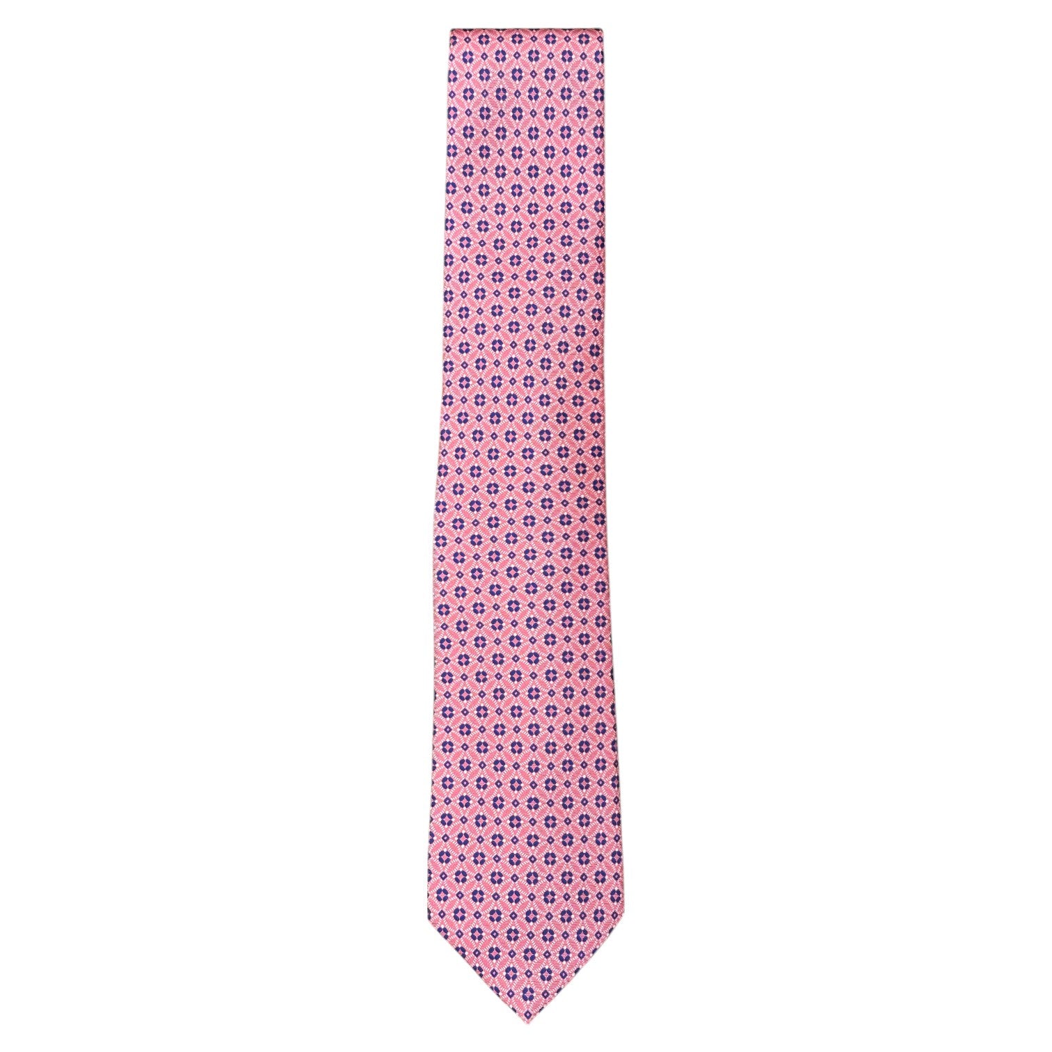 The Atomic Diamond Tie by Robert Jensen is a hand-stitched pink silk tie with a repeating geometric blue and red floral pattern, displayed on a white background.