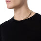 A person wearing the Rag & Bone Aulton Knit Tee in black and a silver chain necklace, shown from the shoulders up against a plain background.