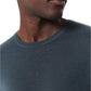 A close-up of a person wearing the Rag & Bone Aulton Knit Tee, featuring its textured dark teal wool blend crewneck, with only the lower face, neck, and upper chest visible against a white background.