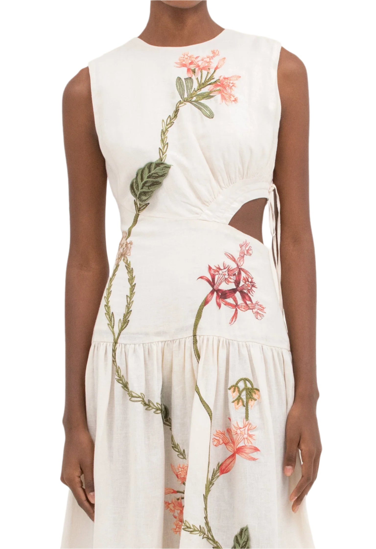 Someone is wearing an Agua by Aguabendita Otono Midi Dress, a sleeveless white embroidered piece featuring vibrant floral patterns and a side cut-out design.