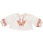 A white, long-sleeve Pink Chicken Girls' Ava Top in toddler size, featuring vibrant orange and pink floral harvest embroidery on the chest and cuffs, perfect for a touch of boho fashion.