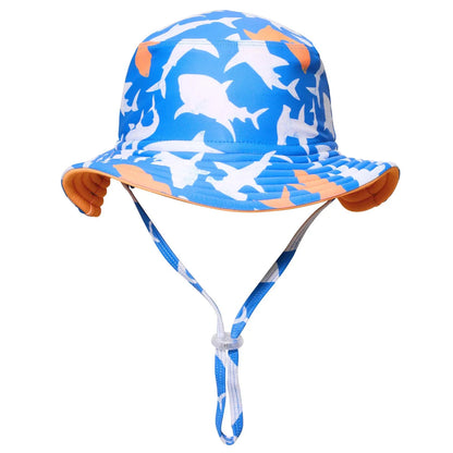 The Snapper Rock Shark Squad Reversible Bucket Hat features orange accents, a white and light blue shark print, adjustable chin strap, and UPF50+ sun protection.