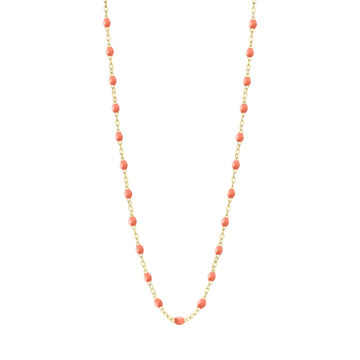 Presenting the Gigi Clozeau Classic Gigi Necklace, 16.5": an exquisite piece adorned with pink beads beautifully arranged along a yellow gold chain. These captivating jewels seamlessly enhance any ensemble, providing an ideal mix of elegance and allure.