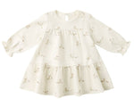 The Quincy Mae Baby Girls’ and Girls’ Tiered Jersey Dress features a cream color, long sleeves, a flared skirt with small bunny face prints, and comes with coordinating bloomers for an adorable look.