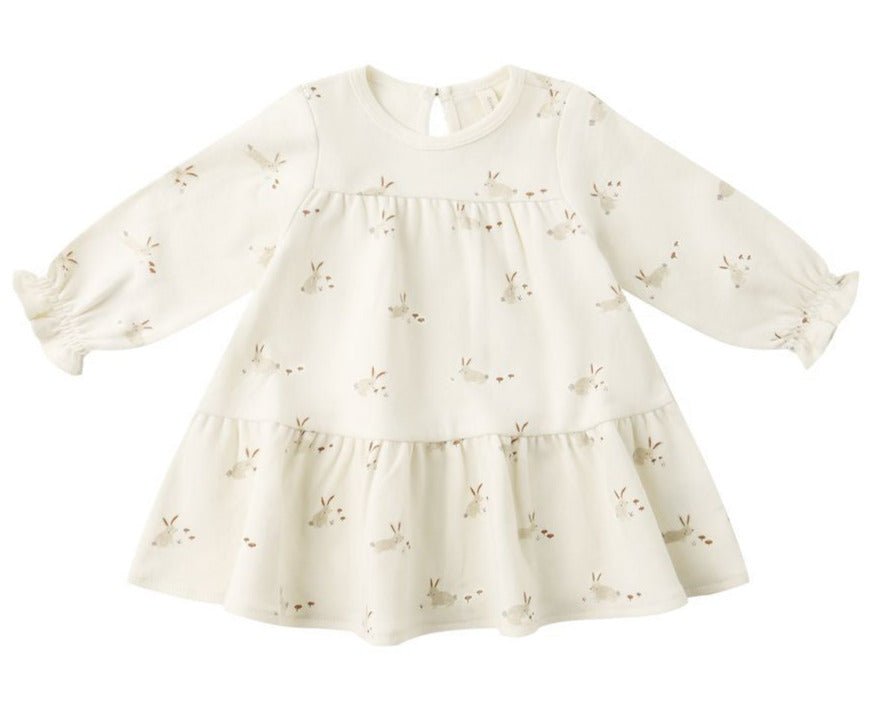 The Quincy Mae Baby Girls’ and Girls’ Tiered Jersey Dress features a cream color, long sleeves, a flared skirt with small bunny face prints, and comes with coordinating bloomers for an adorable look.
