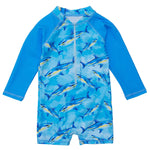 Snapper Rock Jawesome Waves Sunsuit featuring a shark print design in blue, long sleeves for children, and crafted by the brand Snapper Rock.