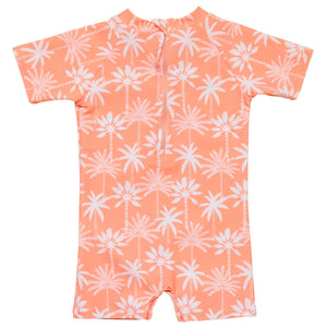 The Snapper Rock Baby Boys' Cali Palms Recycled SS Sunsuit is a peach short-sleeve romper with white palm print, UPF50+ protection, and a zipper back.
