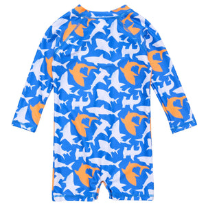 The Snapper Rock Baby Boys' Shark Squad LS Sunsuit features a blue long-sleeve one-piece with an orange and white shark pattern and UPF50+ protection, shown from the back for safe, fun days in the sun.