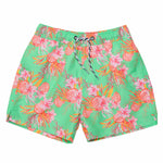 These Snapper Rock Coastal Shells Swim Shorts for kids showcase a green design with a pink tropical floral pattern and an adjustable black-and-white drawcord waist.