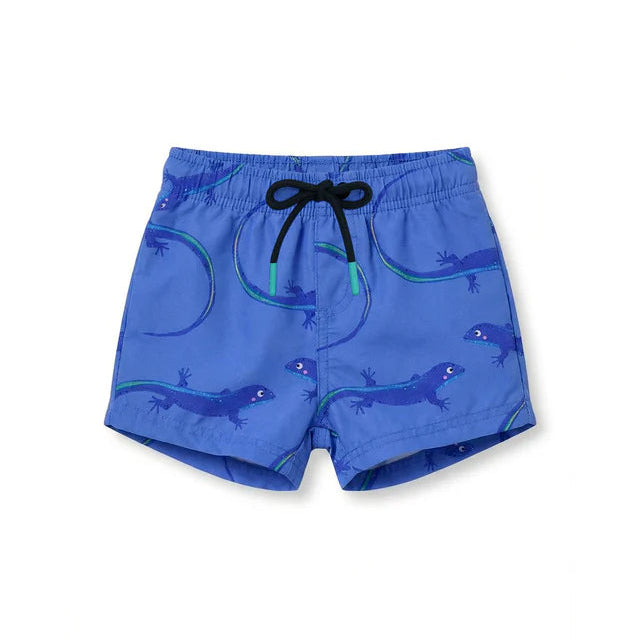 Pepita & Me Baby Boys' and Boys' Lobito Isleño Swim Trunks feature a drawstring waistband, quick-dry fabric, and a playful pattern of dark blue and green lizards.