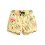 Bright and playful, Pepita & Me's Baby Boys' and Boys' Casitas Isleñas Amarillo Swim Trunks feature quick-dry fabric, a drawstring waist, and a colorful palm tree and house print in pink, green, and orange.