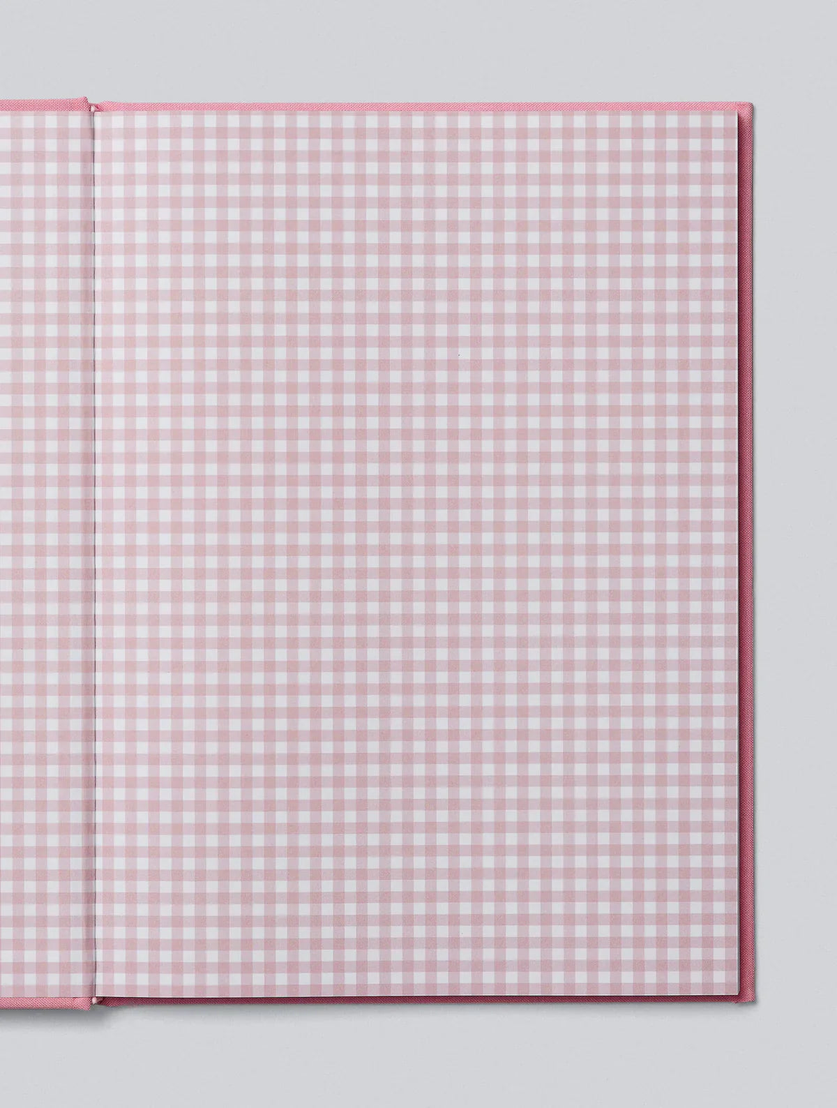 A Write To Me pink and white baby journal with a gingham pattern, perfect for capturing memories.