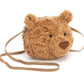 The Jellycat Bartholomew Bear Bag is a plush, round, brown cross-body bag shaped like a teddy bear’s head, featuring cute ears and a long strap.